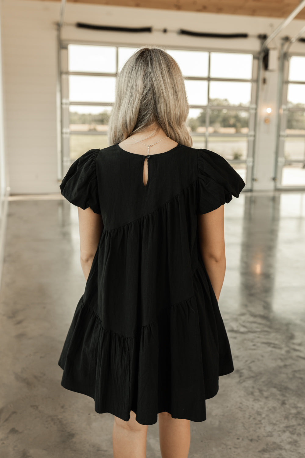 ASYMMETRIC BABYDOLL MINI DRESS